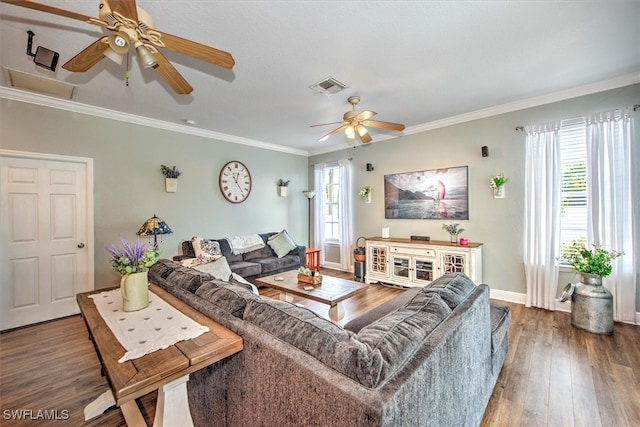 living room featuring ornamental molding, hardwood / wood-style flooring, a wealth of natural light, and ceiling fan