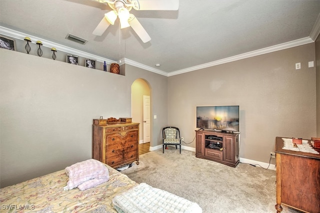 carpeted bedroom with crown molding, a textured ceiling, and ceiling fan