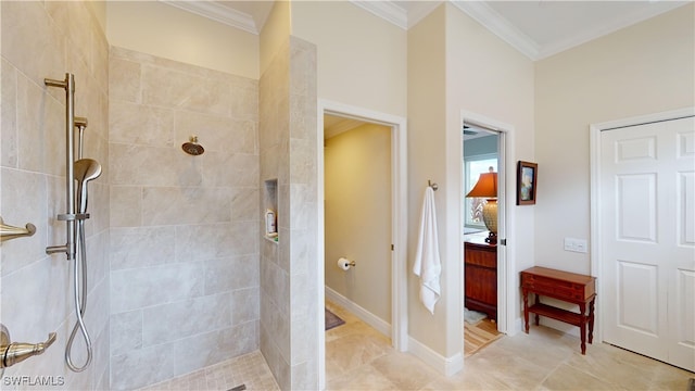 bathroom with tiled shower and ornamental molding