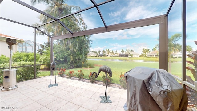 unfurnished sunroom featuring a water view and a wealth of natural light