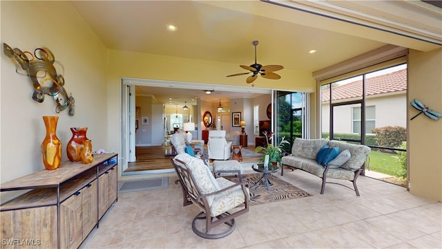 living room with light tile patterned floors and ceiling fan