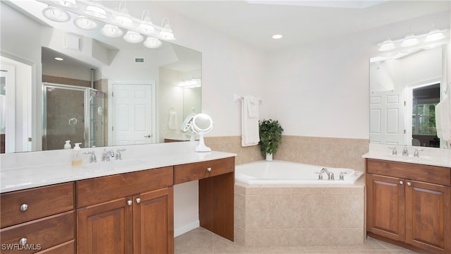 bathroom with vanity, independent shower and bath, and tile patterned floors