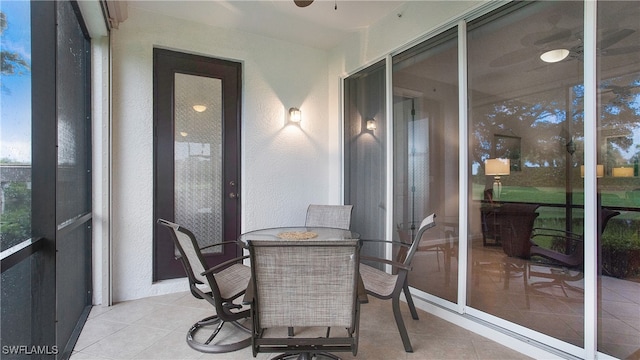 sunroom / solarium with ceiling fan