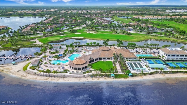 birds eye view of property with a water view