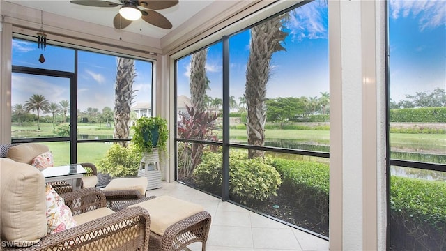 sunroom / solarium featuring ceiling fan and a wealth of natural light