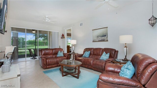 tiled living room featuring ceiling fan