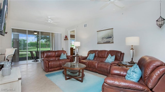 living area featuring light tile patterned floors, ceiling fan, and visible vents