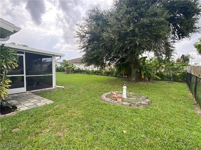 view of yard featuring a sunroom