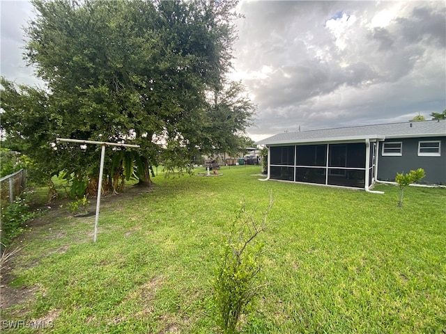 view of yard featuring a sunroom