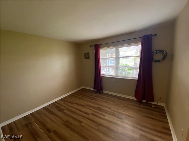 empty room featuring hardwood / wood-style flooring