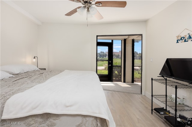 bedroom with light hardwood / wood-style flooring and ceiling fan