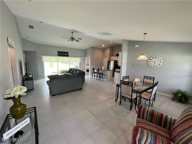 tiled living room with vaulted ceiling and ceiling fan