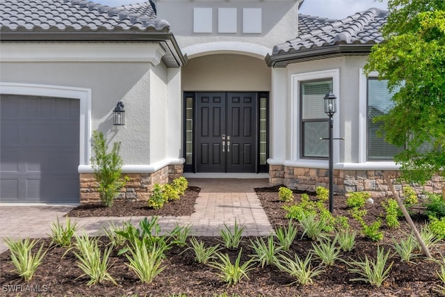 doorway to property featuring a garage