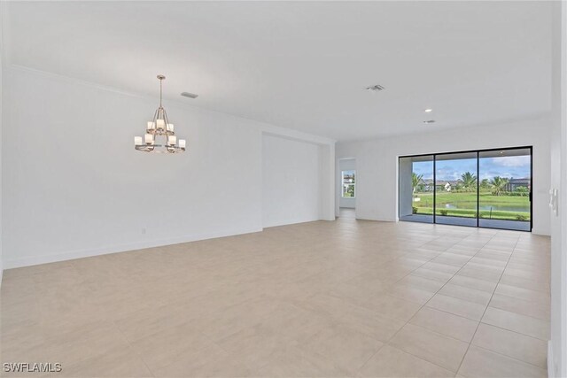 11902 Raggio Dr, Fort Myers, FL 33913 - spare room featuring a chandelier and light tile patterned floors
