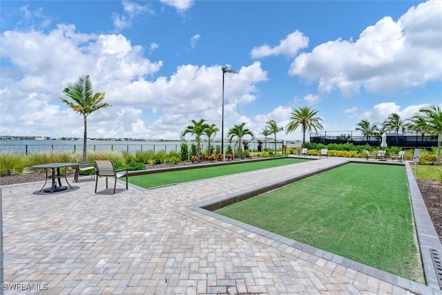 11902 Raggio Dr, Fort Myers, FL 33913 - view of home's community with a game area and a water view