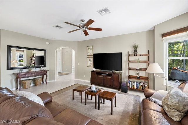 living room featuring ceiling fan and light tile patterned floors