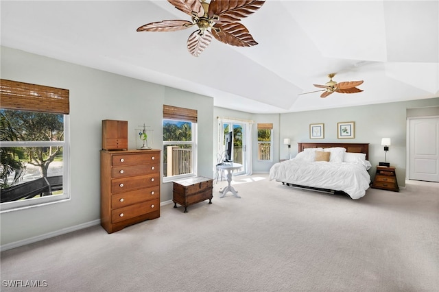 bedroom featuring a tray ceiling, ceiling fan, and carpet floors