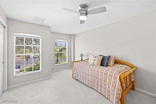 bedroom with visible vents, carpet flooring, ceiling fan, and baseboards