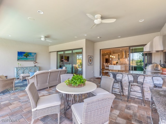 interior space with ceiling fan