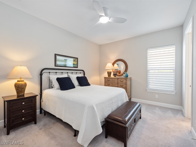 bedroom featuring ceiling fan and light colored carpet