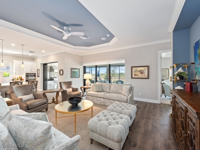 living room featuring ornamental molding, dark hardwood / wood-style flooring, and ceiling fan