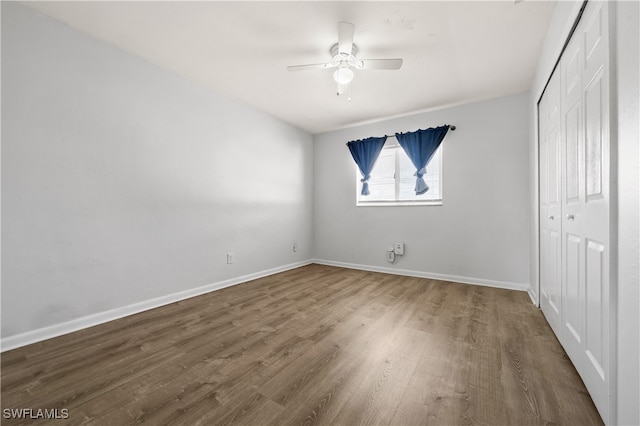 unfurnished bedroom featuring ceiling fan and wood-type flooring