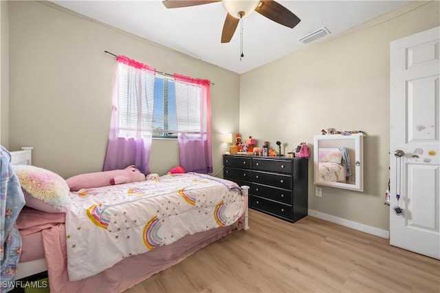 bedroom with ceiling fan and light wood-type flooring