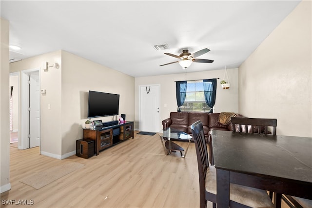 dining room featuring light hardwood / wood-style flooring and ceiling fan