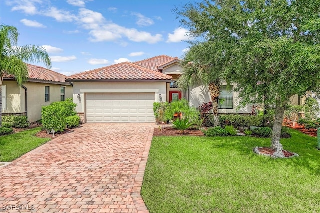 view of front of house with a garage, a front lawn, decorative driveway, and stucco siding