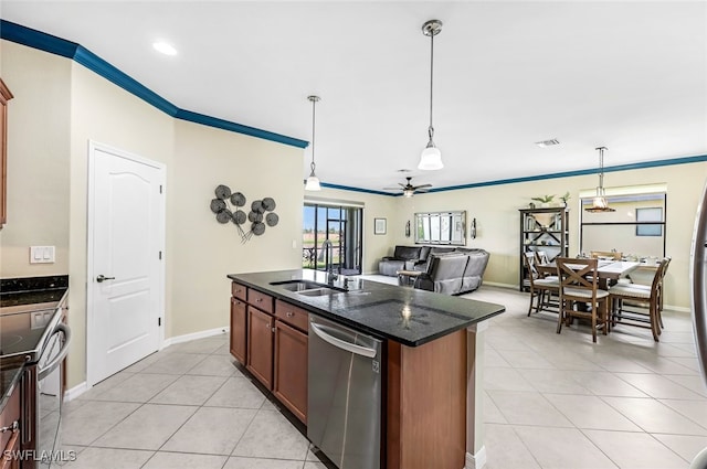 kitchen featuring pendant lighting, crown molding, stainless steel appliances, visible vents, and a sink