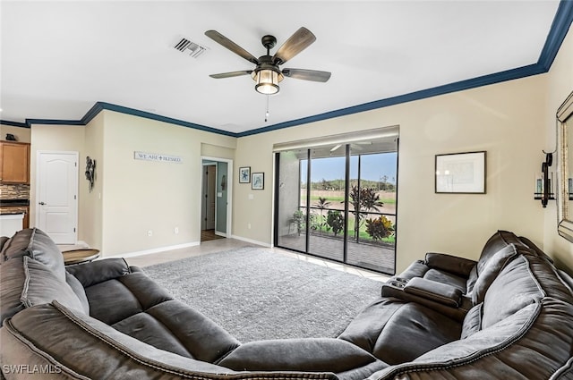 living room with ceiling fan and crown molding