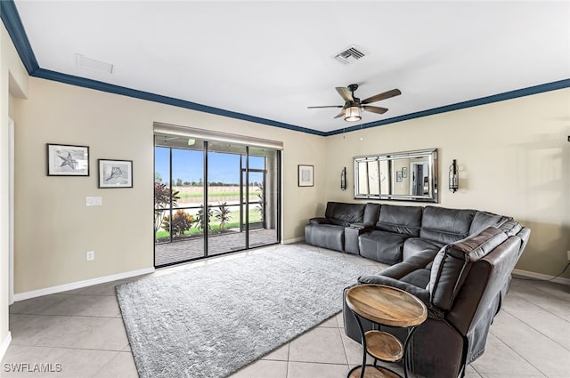 living room with ceiling fan, ornamental molding, and light tile patterned floors