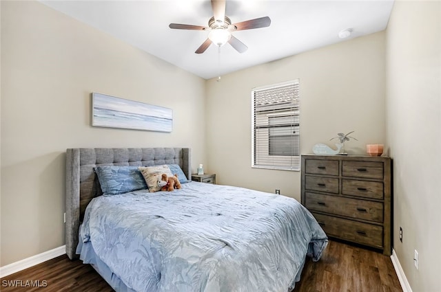 bedroom with ceiling fan and dark hardwood / wood-style floors