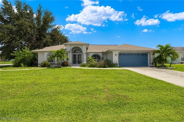 view of front of home featuring a garage and a front lawn