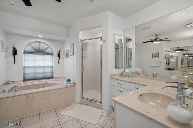 bathroom with ceiling fan, separate shower and tub, and vanity