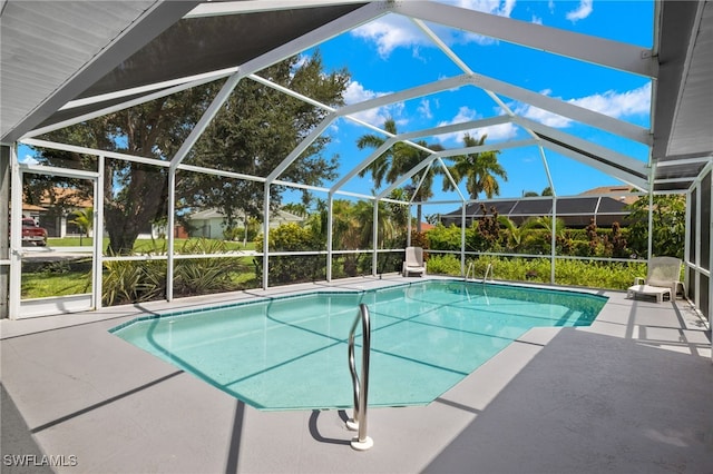 view of pool featuring a lanai and a patio area