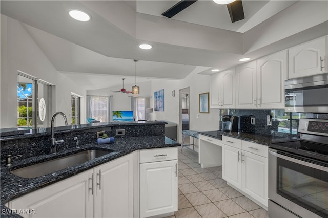 kitchen with white cabinets, appliances with stainless steel finishes, sink, and ceiling fan