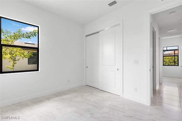 unfurnished bedroom featuring a closet