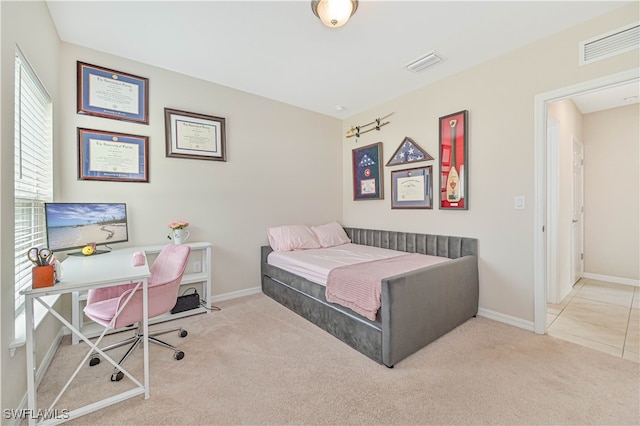 bedroom with light carpet