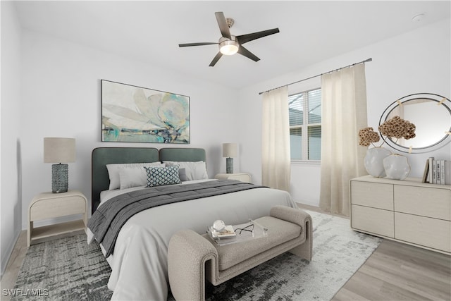 bedroom featuring ceiling fan and light hardwood / wood-style flooring