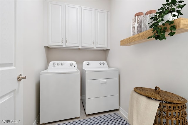 laundry area with cabinets and separate washer and dryer