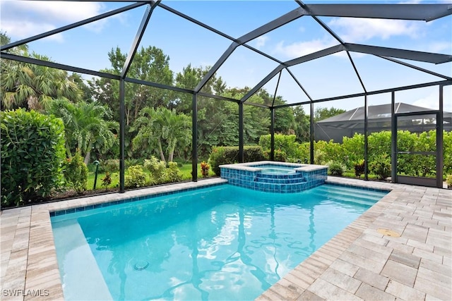 view of pool with an in ground hot tub and glass enclosure