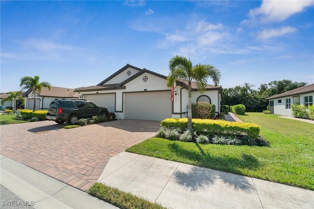 view of front of home featuring a garage and a front lawn