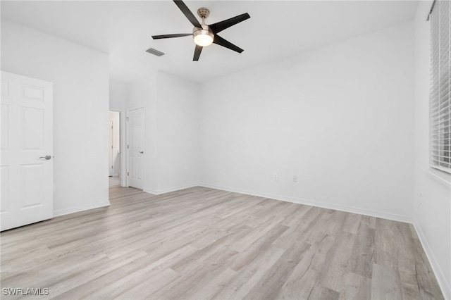 spare room featuring ceiling fan and light hardwood / wood-style floors