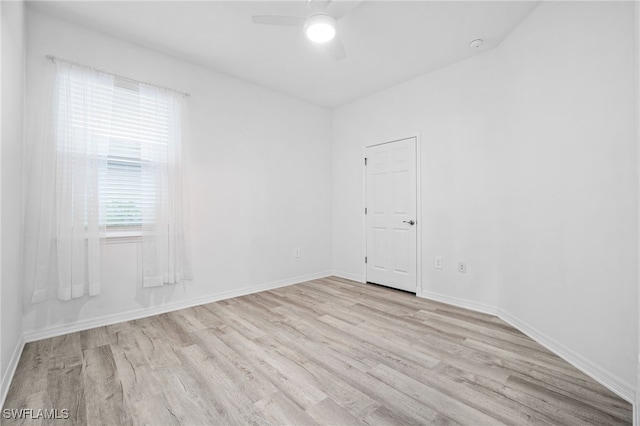 spare room featuring ceiling fan and light hardwood / wood-style floors