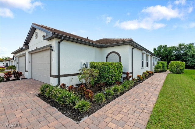 view of side of home with a garage