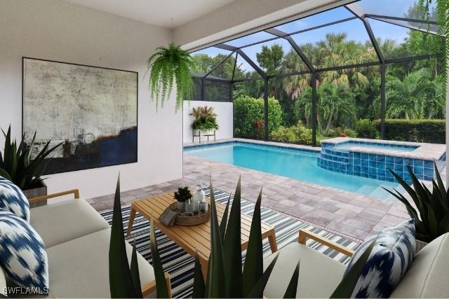 view of pool with an in ground hot tub, a lanai, and a patio