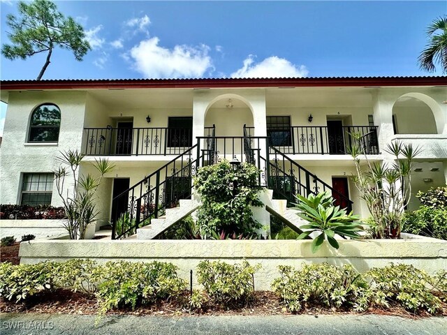 view of front of house featuring a balcony