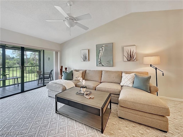 carpeted living room featuring ceiling fan, baseboards, vaulted ceiling, and a textured ceiling