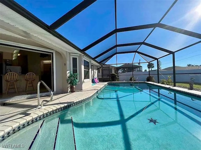 view of pool featuring a lanai and a patio area